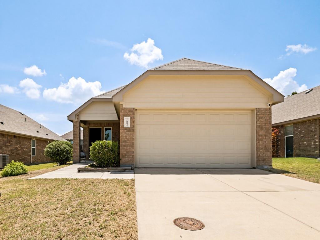 Beautifully maintained, move-in ready home in a desirable Ennis neighborhood! This inviting home offers an open-concept floor plan with modern finishes, spacious living areas, and a private backyard—perfect for first-time buyers, downsizers, or anyone looking for low-maintenance living. Step inside to find durable luxury vinyl plank flooring flowing throughout the main living spaces, soaring ceilings that create an open and airy feel, and an abundance of natural light. The spacious living room seamlessly connects to the dining area and kitchen, making entertaining effortless. The well-appointed kitchen features rich espresso cabinetry, granite countertops, stainless steel appliances, tile backsplash, ample cabinet storage, and generous counter space for meal preparation. The adjoining dining area is filled with natural light and offers the perfect setting for everyday meals or hosting guests. The oversized primary suite provides a peaceful retreat with plush carpeting, vaulted ceilings, and an ensuite bath featuring granite countertops, a large vanity, and a walk-in glass-enclosed shower. Secondary bedrooms are generously sized with fresh carpet and share a beautifully maintained full bath. Outside, enjoy a fully fenced backyard with plenty of room for pets, play, gardening, or creating your own outdoor oasis. The covered front porch offers welcoming curb appeal, while the attached two-car garage provides additional storage and convenience. Ideally located with easy access to schools, shopping, dining, and major highways, this home offers comfort, style, and everyday convenience in one attractive package.