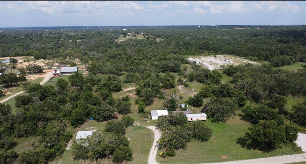 Discover the potential of this 12.3-acre property featuring a 1-bedroom, 1-bath farmhouse and a 3-bedroom, 1.5-bath mobile home, both with electricity and water already in place. Whether you're looking for a multi-family setup, rental income opportunity, homestead, or investment property, this acreage offers a variety of possibilities.

Both homes are fixer-uppers and will require some work, making this an excellent opportunity for buyers looking to add their own personal touch and build equity. The property also includes a shop and a well house, providing additional functionality and storage space.

With plenty of room to spread out and enjoy country living, this property offers the perfect combination of acreage, existing infrastructure, and endless potential. Bring your vision and make this unique property your own.
