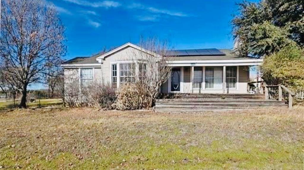 Attractive double-decker front porch. The wood burning fireplace fills the home with cabin like feel  Natural light from oversized bay window reflects beautifully across the original wood floors. The wrap-around back deck, surrounded by mature trees, becomes a private retreat with views of the countryside. Additional storage by the double bay carport. New HVAC installed August 2021.