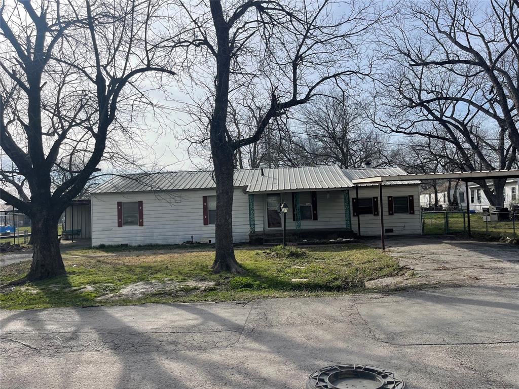 This 4-bedroom, 1.5-bath home is full of potential and ready for its next chapter. If you’ve been looking for a property where you can roll up your sleeves and truly make it your own, this is your opportunity. The home does need some love, attention, and repairs making it ideal for investors, renovators, or buyers eager to create a personalized space from the ground up.

Situated next to Wolfe City Elementary School, the location offers everyday convenience. Outside, you’ll find a spacious fenced backyard, which is perfect for pets, play, or future outdoor living ideas. It also includes a storage building for tools or equipment. The heated garage provides excellent space for hobbies, projects, or a workshop setup. With vision and care, this property could be transformed into something truly special.