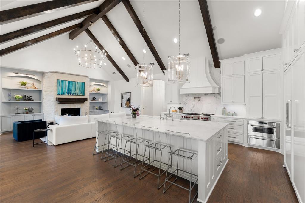 Welcome to a true unicorn in the heart of Prosper—where luxury, privacy, & design come together on just under an acre in the prestigious community of Whispering Meadows. Perfectly positioned on a premium corner lot with no neighbors behind, this Dave R Williams stunning home offers breathtaking, uninterrupted views of lush green space. Step inside and prepare to be captivated. The expansive single-story floor plan is thoughtfully designed with 4 spacious bedrooms, 4 full baths, a game room, & a media room, offering the perfect blend of everyday comfort and elevated entertaining. At the heart of the home, a completely reimagined designer kitchen steals the show—featuring all-new high-end appliances, Italian marble, stunning finishes, & a massive prep kitchen pantry you must see to believe. Every inch of this home has been meticulously updated with over $600K in top-to-bottom designer upgrades  - truly a turnkey masterpiece. The living & dining spaces are nothing short of spectacular, highlighted by dual sliding glass doors spanning the back of the home, creating a seamless indoor-outdoor experience & overlooking the private backyard oasis. The primary suite is a retreat of its own, offering an oversized layout with a private attached study, a spa-inspired bathroom, & luxurious finishes throughout. Additional standout features include a dedicated craft room with private exterior access to a dog run, a wine room with built-in desk & a stylish wet bar & more - every detail thoughtfully curated. Step outside to your own resort-style escape—complete with a sparkling pool and spa, oversized covered patio with fireplace, outdoor kitchen, bar & automated drop-down shades. You will also appreciate the rare 5-car garage & TEXAS BASEMENT space! All on an expansive lot with room to breathe- an incredibly rare find in Prosper. This is more than a home—it’s a fully transformed, designer showplace where no detail has been overlooked. Opportunities like this are few and far between.