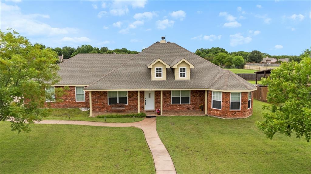**Your Serene Oasis Awaits in Community ISD!** Discover the perfect blend of comfort and style in this exquisite 4-bedroom, 2-bathroom residence set on a sprawling 1-acre lot, just moments away from the picturesque Lake Lavon. This home embodies tranquility with its peaceful surroundings and modern conveniences, ideal for those seeking both space and serenity. Step inside to find a spacious and bright interior adorned with fresh paint and an inviting open floor plan. The laminate and tile flooring guide you through the main living areas, while new plush carpeting in the bedrooms adds a touch of luxury. The versatile formal dining room can easily transform into a home office, catering to all your lifestyle needs.  The split primary suite offers a private escape with an ensuite bath featuring a luxurious garden tub, separate shower, and ample storage space. The heart of this home, the large living room, boasts a cozy fireplace, setting the stage for warm gatherings. Cooking enthusiasts will appreciate the functional kitchen, complete with an island and abundant Corian counter and cabinet space, flowing seamlessly into the living area. A walk-in pantry ensures all your culinary essentials are close at hand. Outdoor relaxation is a breeze with both a covered front porch and a great covered patio at the back that is 31x17, perfect for enjoying a morning coffee or evening sunset. The expansive backyard offers ample space for leisure and play.
Situated just minutes from Lake Lavon, this serene haven provides the perfect balance of rural charm and modern convenience. Embrace the peaceful environment while remaining close to all the outdoor activities this prime location offers. Your dream home awaits on this picturesque 1-acre retreat.