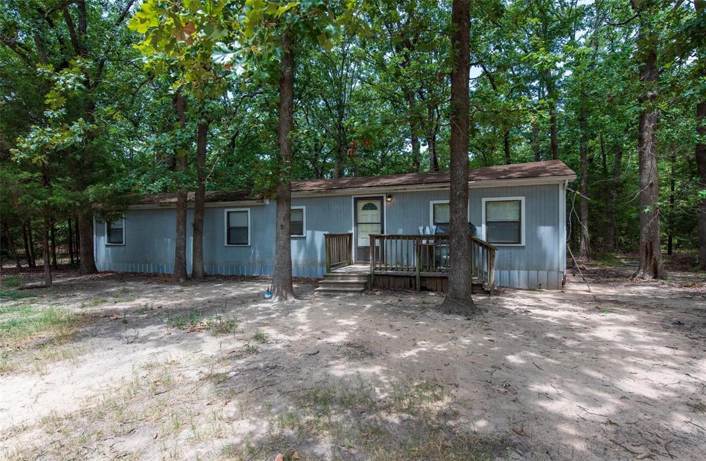 11.59-Acre Wooded Retreat with Home and Shop Near Pat Mayse Lake! Discover an incredible 11.59-acre property in Paris, Texas, less than a mile from the serene Pat Mayse Lake. This expansive plot includes a cozy one-bedroom, one-bath manufactured home and a small shop, perfect for hobbies or storage. Imagine the possibilities—develop a recreational retreat, a residential haven, or both! With endless outdoor activities like fishing, boating, and hiking nearby, this spot is ideal for nature enthusiasts and vacationers. The property's location offers a blend of rural charm and convenience, making it attractive for homebuyers seeking tranquility and investors eyeing growth potential. This prime location ensures a peaceful countryside feel while providing easy access to local amenities. Don't miss this rare opportunity to own substantial land in a prime location! Whether you're planning to build your dream home, invest, or simply enjoy the open space, this property delivers.