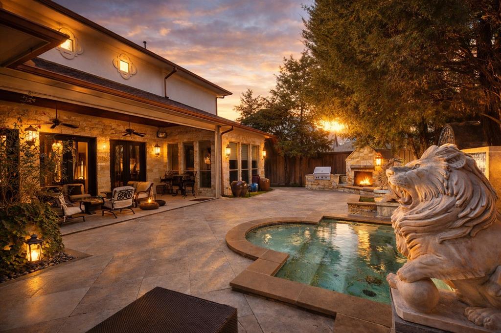 Step into this extraordinary home

A grand stone staircase with wrought iron railing welcomes you, set against floors of Turkish travertine. Exposed firewood beams painstakingly stained to perfection. The quality is so extraordinary that two cranes broke during installation.

Throughout the home, hand-scraped oak floors, multiple marble fireplaces crowned with elegant molding, and plantation shutters elevate every space.

The living room boasts gorgeous iron French doors that open to a sprawling outdoor patio, seamlessly blending indoor and outdoor living.

The oversized kitchen is a chef’s dream, featuring a massive granite island with oval seating for six, custom maple cabinetry, and top-of-the-line appliances.

For entertainment, enjoy a massive media room complete with billiards, home theatre, and a commercial-grade pub with stainless steel finishes.

The library-sized study is wrapped in rich maple wood paneling, with soaring ceilings, plantation shutters, and semi-circular windows that flood the room with natural light.

Stay fit in the exercise room, equipped with 4,500 lbs of professional-grade equipment.

Wine enthusiasts will love the climate controlled wine cellar, capable of holding 3,000 bottles.

The primary suite is a retreat in itself with a custom iron chandelier, breathtaking backyard views, and a spa like bathroom featuring diamond pattern granite floors, double sinks, an oversized shower with three body sprays, plus a urinal and bidet. The master closet boasts a soaring ceiling and a hidden passageway leading to the library.

Step outside to your resort-style patio, with an in-ground spa, towering 15-foot privacy fence, built-in grill, outdoor fireplace, oversized TV, double ceiling fans, and dining area — all watched over by two majestic custom stone lions.

This home is truly one-of-a-kind, offering a blend of artistry, function, and luxury that must be seen to be believed.
Photos enhanced with walls painted white