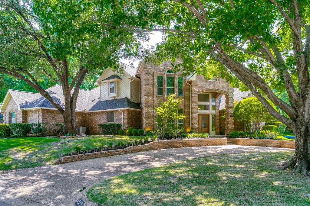 Updated move-in ready on over one-third acre corner lot in highly coveted Woodland Hills ready for move in!  4 bedrooms, 4 full baths, 2 living areas with fireplaces and soaring ceilings, 2 dining areas. Second living space can be closed off and used as an in-law suite with own kitchenette, bathroom, and outdoor access. Vinyl flooring through first floor with tile in kitchen area. Breakfast area has sliding glass wall to offer full view of wraparound covered back patio and huge yard with saltwater pool with diving board. Perfect for entertaining. Oversized primary suite has sitting area, door to backyard, walk-in closet, and updated with designer bath with separate vanities, tons of storage, freestanding tub, and double curbless shower.  One additional en suite bedroom downstairs along with dining room when you enter. Upstairs landing features built-in's with desk and 10-gigabit home wiring. Jack & Jill bedrooms upstairs with walk-in closets with custom closet systems. Tons of built-in's and architectural details throughout, 2 fireplaces, 3 car garage with extra parking on the front circular drive or driveway along the side of the house. Woodland Hills offers a park, playground, and lake within the neighborhood. Down the street from the new HEB and Glade Parks shopping plaza. Convenient access to 121, 183, 360, and minutes to DFW airport.