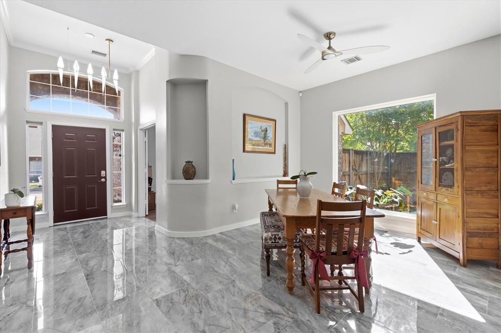 Welcome to this beautifully updated 3-bedroom home with a private study and two spacious living areas, perfectly positioned on a desirable corner lot with mature trees and outstanding drive-up appeal. Inside, the completely remodeled kitchen is a genuine showstopper, featuring updated cabinetry, quartz countertops, upgraded appliances, a designer faucet, new sink, and elegant porcelain tile flooring. Rich engineered wood flooring flows throughout the entire home — no carpet anywhere — adding warmth and a sophisticated, contemporary feel at every turn. The impressive floor-to-ceiling porcelain fireplace commands attention as the stunning focal point of the main living space, bringing a level of luxury that sets this home apart. Both bathrooms have been modernized with stylish finishes and brand-new showers completed in 2025. The spacious primary suite is your personal retreat, complete with a large walk-in closet and a beautifully updated bath designed for comfort and style. Updated lighting throughout ties the entire home together with a polished, modern finish. Located in one of McKinney's most sought-after pockets, this home is zoned for the highly acclaimed McKinney Boyd High School, a 6A campus consistently recognized for academic and athletic excellence. Nature lovers will appreciate being just minutes from fantastic walking trails and parks, offering easy access to outdoor recreation year-round. Food enthusiasts will love the incredible variety of restaurants and dining options just moments away — from local favorites to popular national brands — making weeknight dinners and weekend outings effortless. When it comes to convenience, this location delivers. Easy access to US-75, Highway 380, and the Sam Rayburn Tollway connects you to the greater DFW metroplex with ease, making commutes and travel stress-free. This is the perfect blend of modern updates, functional living, and an unbeatable location. Schedule your private tour today!