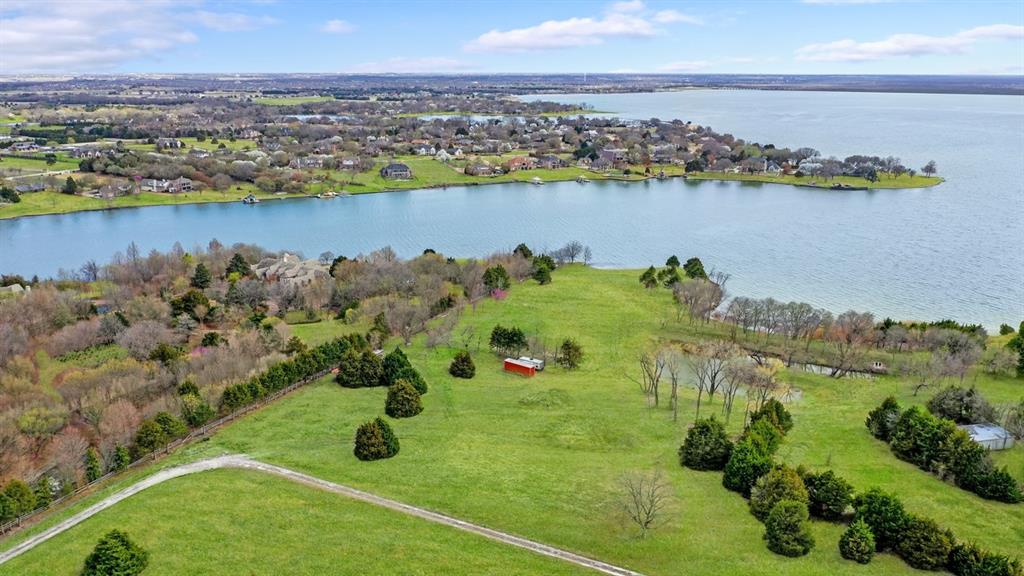 Only 11 miles from George Bush Freeway, an incredibly rare opportunity to purchase approximately 1.5 + or - acres of lakefront land located on beautiful Lake Ray Hubbard. This property has approximately 250 ft + or - of lakefront shoreline providing a perfect space for breath-taking views. Build your dream lakefront estate overlooking Lake Ray Hubbard and enjoy lakeside living at its best near great schools, shopping and restaurants. This secluded haven on Lake Ray Hubbard provides the privacy you are looking for with easy access to lakeside living. The entire 6.1 acre parcel is in the process of being surveyed and platted to include 3 approximately 2 (plus or minus) acre lots. Don't miss this one!