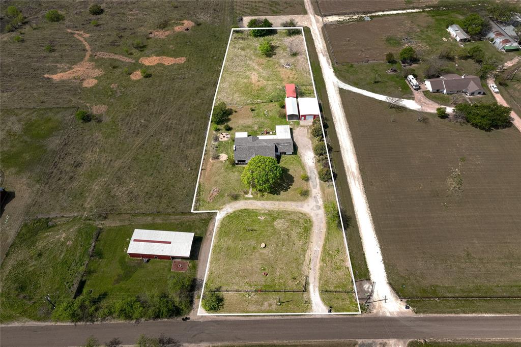 This four bedroom, three bath home on 2.31 acres in Lorena, Texas offers a functional layout with room for animals, projects, guests, and everything in between. Natural light fills the main living spaces through large windows, and a dedicated sunroom extends your usable square footage year round. A bedroom and full bath with a separate exterior entrance gives you a private space that works as a guest suite, game room, or multigenerational setup without disrupting the main home. The property includes a 60x40 workshop, covered RV parking, underground storm shelter, two covered animal pens, a fenced backyard, and a side yard ideal for a garden or coop. No HOA. Zoned to Lorena ISD, a highly regarded small-town district known for its strong academics, tight-knit community, and the kind of personalized attention that larger districts simply cannot offer. Positioned with easy highway access approximately 20 minutes from downtown Waco and Temple.