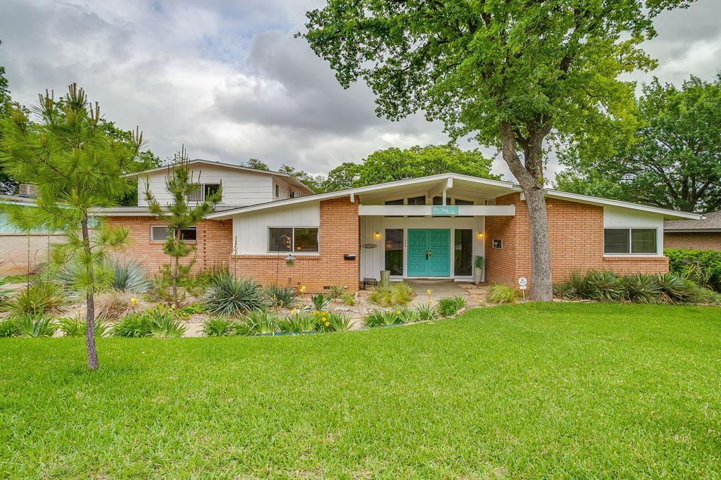 Are y'all ready to time travel?? MCM lovers rejoice! 1525 Jenson is just fabulous in every way. From the funky cool exterior with period appropriate paint colors to the insane basically untouched interior to the backyard with all the Palm Springs vibes! When you enter the home, you are immediately wrapped in warmth with the dramatic wood double doors and formal foyer. From there, you can go to the right where 3 bedrooms flank the right side of the home with the master being tucked away on the back corner. You will be mesmerized with the original colorful bathrooms featuring butter yellow and dusty pink fixtures! To the left of the foyer, you enter the most adorable kitchen with so many original features and charm for days. Directly behind the foyer is the literal heart of the home, the den. The brick fireplace anchors one side of the room while the glass wall overlooking the patio and backyard give you a view you will never tire of! And speaking of the patio, it's huge! Truly an extension of the home, this is what outdoor living was made for. The backyard oasis is just starting to show it's Spring colors and you will LOVE the deck and above ground pool this Summer. Lush landscaping, room for kids or dogs or gardening! But let's go back inside! Off of the kitchen, there is a formal dining room that is ready for your holiday dinners or neighborhood cocktail party! The staircase leads to one of the coolest parts of the house....the 4th bedroom which can also be a game room, additional living space, office or gym! It has a full bathroom, bar, balcony to outside and so.much.flexibility to be whatever you want it to be. Guest suite? In-law retreat? You get to choose. This house is one of the good ones. It deserves to be preserved and loved as much as the current owner loves it. Don't miss your chance to buy a piece of Fort Worth history! AND the seller just put a BRAND NEW ROOF on the house!