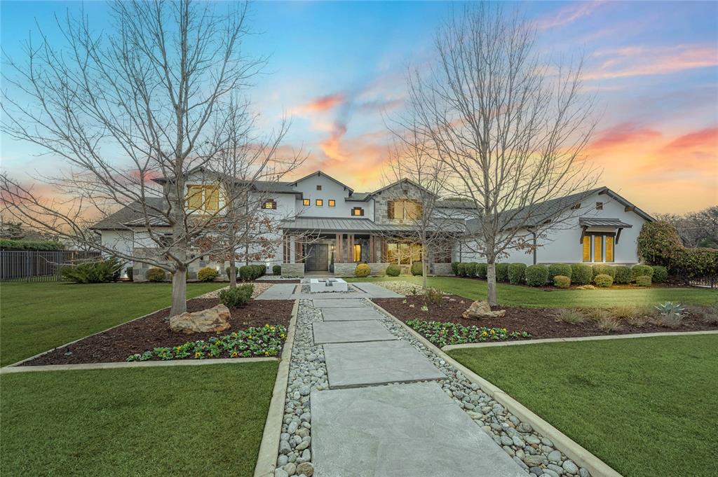 Spacious, 1-owner custom with modern flair!  5 BRs all with ensuite baths + 3 half baths. Luxurious primary BR wing features coffee bar, 2 massive closets, laundry area, exercise rm, fireplc & french doors to pool. Primary bath offers marble flrs, quartz vanities, W-I shower, free-standing tub, 2 separate water closets & gorgeous tile work! At the heart of the home is the massive island kitchen with Wolf Range + dbl Wolf wall ovens, 2 dishwashers, Subzero, brkfast bar & huge W-I pantry. The kitchen blends into family rm with contiguous wood-look tile & here you'll enjoy the 2-sided fireplc flanked by french doors to the outdoor living overlooking saltwater pool. The billiard room + separate media rm are also downstairs, creating a wonderful entertaining flow! A private home office with blt-in shelves & safe room is located at the back of the home. You'll love the mudroom w-lockers leading out to 6 garage spaces! There is a huge laundry-craft room with loads of workspace! 2nd level offers a study nook off the back stairs, a liv-sitting room, game room with balcony, laundry rm, 4 large BRs all with spacious W-I closets.  Situated on a 1 acre lot with N-S exposure & at the end of the culdesac for privacy! Extras: plantation shutters, hardwood flrs, solid core doors, cargo lift in tandem garage, ss speakers, safe rm with 4 in center walls. Short walk to Carroll Middle School & easy access to Hwy 114, DFW airport and SL Town Square shopping!