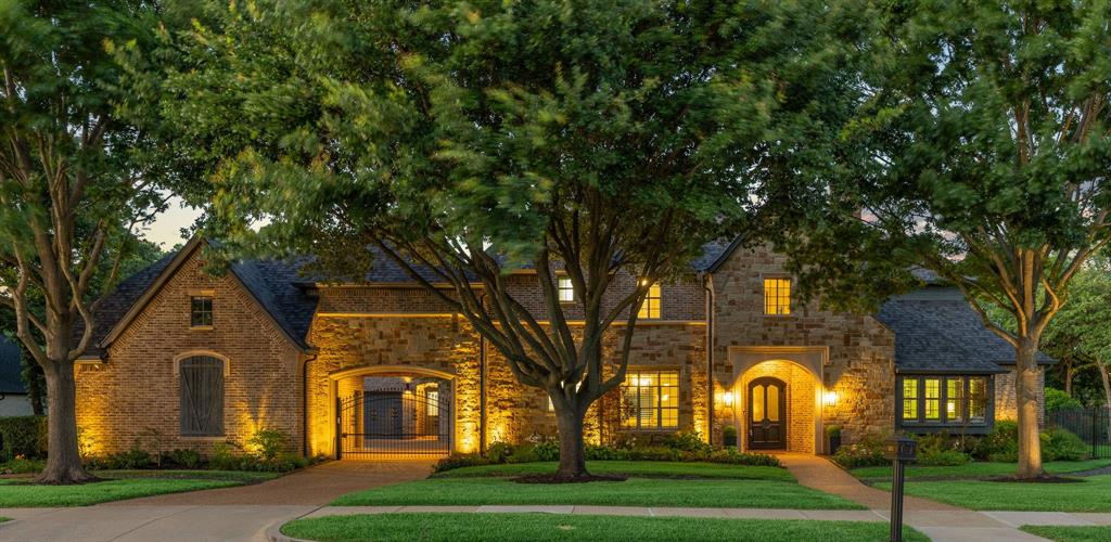 Nestled within one of Keller's most sought-after neighborhoods, this exceptional residence offers refined living, luxurious amenities, and impeccable attention to detail throughout. Upon entry, rich refinished woodwork and inviting living spaces create an immediate sense of warmth and elegance. The home flows effortlessly from one space to the next, leading to a chef-inspired kitchen that serves as the heart of the home. Designer lighting, a beautifully updated island, stylish fixtures, and seamless connectivity to the surrounding living and entertaining areas make it equally suited for everyday living and memorable gatherings. The private owner's retreat offers a peaceful escape, while thoughtful enhancements throughout the home—including designer paint selections, custom barn doors, statement lighting, refinished architectural details, and beautifully appointed baths featuring premium Toto fixtures—reflect an commitment to quality and craftsmanship. A dedicated media room, complete with a custom candy station, updated projection system, and specialty lighting, delivers an exceptional cinematic experience, while formal and casual living spaces provide the perfect backdrop for intimate evenings and large-scale entertaining. The backyard opens directly to scenic walking trails and overlooks stunning water views, creating a rare sense of privacy and serenity. Begin your mornings with coffee as the sun reflects across the water, enjoy evening strolls along the trail, or unwind poolside on warm Texas nights. Meticulously maintained, 1821 Kinsale Drive presents a rare opportunity to own a luxury home that blends timeless craftsmanship, exceptional indoor-outdoor living, and one of Keller's most tranquil settings. Here, luxury isn't just found inside the home—it's experienced every day.