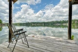 Sitting on the water in Hideaway Lake, this spacious 4-bedroom, 2.5-bath home offers approximately 2,852 square feet of comfortable living space designed for both everyday enjoyment and entertaining. From the moment you arrive, you'll appreciate the inviting curb appeal, lush landscaping and the sense of privacy that makes this property feel like a retreat. Inside, generous living areas provide plenty of room to gather with family and friends while large windows invite natural light and showcase the beautiful waterfront setting. The thoughtfully designed floor plan offers flexibility for a variety of lifestyles, with spacious bedrooms, abundant storage, and comfortable gathering spaces throughout. The primary suite serves as a relaxing sanctuary, featuring ample space to unwind after a long day. The kitchen is positioned to keep everyone connected, whether preparing a quiet meal at home or hosting guests. Multiple living spaces create a flow for entertaining while still providing cozy areas for relaxation. Step outside and enjoy the natural beauty that makes Hideaway Lake such a sought-after community. Mature trees provide shade and privacy, creating a peaceful backdrop for morning coffee, evening gatherings, or simply enjoying the outdoors. Whether you're looking for a full-time residence or a weekend escape, this home offers the perfect blend of comfort, space, and tranquility. Enjoy your beautiful deck overlooking the middle of the lake and the islands that several Bald Eagles call home. Ample parking allows for easy entertaining. Located within the gated Hideaway Lake community, residents enjoy access to a wealth of amenities including three lakes, golf courses, parks, tennis courts, pickleball courts, swimming pools, dining, and a variety of community activities. The combination of generous living space, stunning surroundings, and resort-style amenities creates an exceptional opportunity to enjoy the East Texas lifestyle. Some photos have been virtually staged.