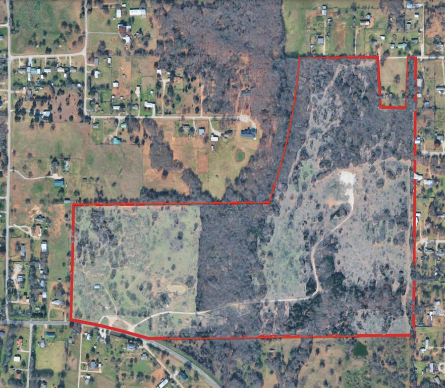 Wonderful 112-acre ranch property offering a great combination of pasture and wooded land. The property features electric and a water well on site, a hay barn, three stock tanks, cross fencing, multiple gated entries, and cattle guards for easy livestock management. A gravel road from Reno Rd provides convenient access to the well site and back portion of the property. The front offers open pastureland, while the back is heavily treed with natural gullies running through the middle and lower sections, creating character and wildlife appeal. A new survey is currently being completed for the entire property. Ideal for ranching, recreation, or investment.