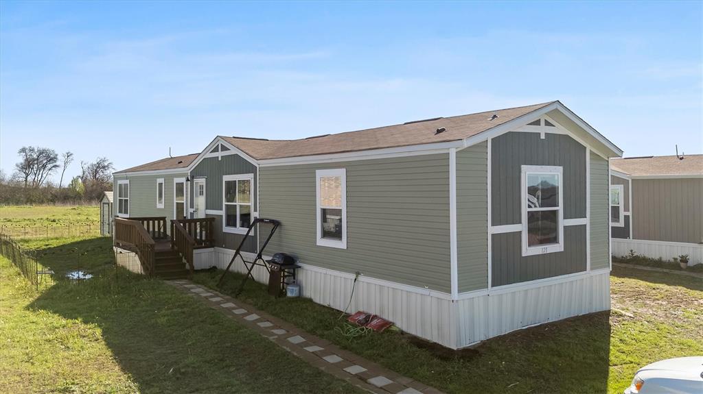 Discover this beautiful 4-bedroom, 3-bath mobile home, well-maintained 2021 manufactured home located in a small, quiet community near Lake Lavon. This spacious home features an open-concept layout with a large kitchen island, abundant cabinet storage, and a split-bedroom design that provides added privacy for the primary suite.

The home includes a fenced yard, perfect for pets, a 12x8 storage shed, and the washer and dryer will convey with the sale. Buyers will appreciate the affordable monthly land lease of approximately $520, plus water and sewer based on usage.
Unlike many nearby communities, this home offers lower monthly lot costs while still providing easy access to shopping, dining, and outdoor recreation at Lake Lavon. The home may qualify for a homestead exemption and can be relocated if desired.