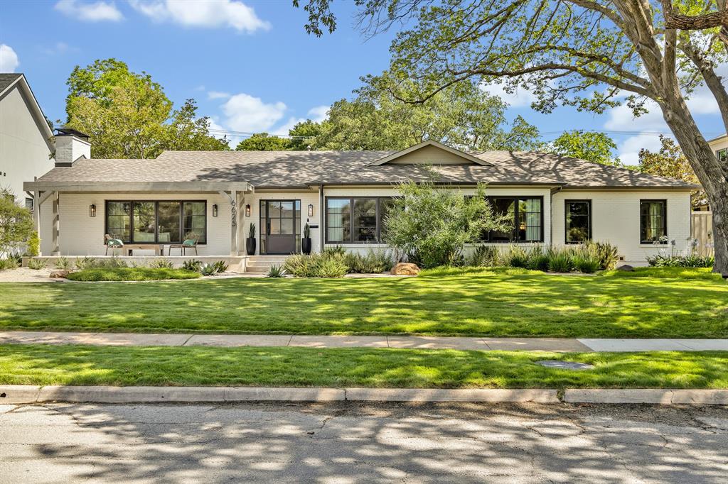 A true Lakewood masterpiece, this one-of-a-kind residence was completely reimagined and expanded in 2023, offering an unparalleled combination of modern sophistication and timeless design. Nestled on an expansive .335-acre lot, this rare single-story ranch is framed by lush landscaping and bathed in natural light from walls of windows that blur the line between indoors and out. At its center, the chef’s kitchen serves as both a statement of style and a culinary dream, showcasing Taj Mahal quartzite countertops, top-of-the-line appliances including a built-in refrigerator, an oversized pantry, and a sunlit breakfast nook. The primary suite defines luxury living with its own fireplace, French doors leading to the backyard, and a spa-inspired bath with soaking tub, standalone shower, and custom-designed closet system. No detail was overlooked in the redesign, with exquisite finishes including designer lighting and tile, rich wood flooring, exposed beams, and three fireplaces that add warmth and character. The floor plan was thoughtfully curated for flexibility, offering multiple living areas, a dedicated office, an exercise room, and a custom-built bonus room currently serving as an art studio. Outdoors, this private sanctuary is designed for both intimate gatherings and grand entertaining with a resort-style pool and spa, expansive covered patio with ceiling fan and motorized screens, and manicured grounds secured by a board-on-board privacy fence. An oversized two-car garage and solar panels adds practicality without compromising elegance. Perfectly positioned and zoned to Lakewood Elementary, this home is more than a residence—it is a statement of refined living in one of Dallas’ most coveted neighborhoods.
