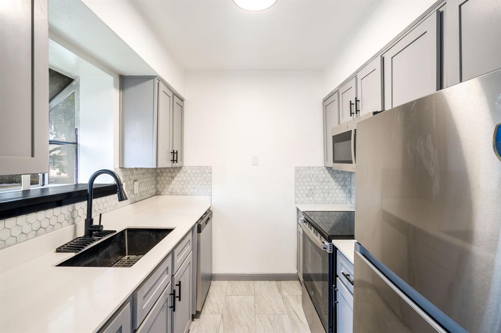 This condo was completely renovated in 2025. It features new flooring throughout, completely updated kitchen with all new appliances, and two updated bathrooms. This move-in ready 2nd story corner unit offers 2 bedrooms and 2 bathrooms across 1,078 square feet. The large living area includes a bay window, while the spacious dining area opens to a private balcony through French doors. The galley kitchen is equipped with a new stove, dishwasher, and included refrigerator, with ample cabinets, counter space, and a garden window. The primary bedroom boasts a huge walk in closet, and a separate laundry room adds convenience. Residents enjoy a well-maintained complex with assigned covered parking, a pool, and park-like grounds. Ideally located near Love Field, UTSW, and downtown, this unit is suitable for professionals, students, and investors seeking a comfortable, updated home.