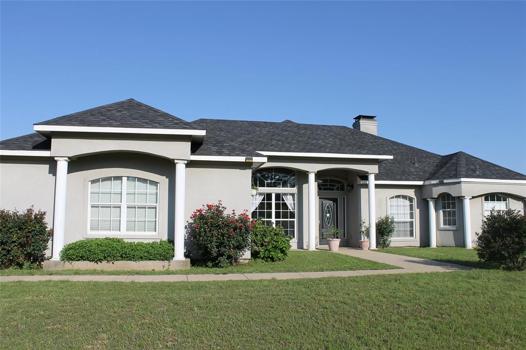 Beautiful horse-friendly, cross-fenced property in Pottsboro ISD near Lake Texoma - tax assessed at $750,000, no city taxes! Gated entrance, 7-stall lighted horse barn - room for animals, entertaining, or just room to breathe! Vaulted ceilings, walls of windows, storage throughout. Granite countertops, quartz granite oversized sink, solid oak cabinets, and a Murphy bed cabinet wall in secondary bedroom. French doors and built-in bookcases in office. Split primary suite has tray ceiling, seating area, separate walk-in closets, and opens to large back patio for morning coffee or sunsets. Master bath features double vessel sinks and walk-in shower. Private well with filtration and water softener. Entertain in the park-like backyard under the Bois d'Arc trees! Easy care flowering shrubs, fruit trees and vines grow on property. Stunning nature views out every window! Minutes from Hagerman Wildlife Refuge, lake recreation, golf, and dining, yet easy access to Hwy 82 and Hwy 75.