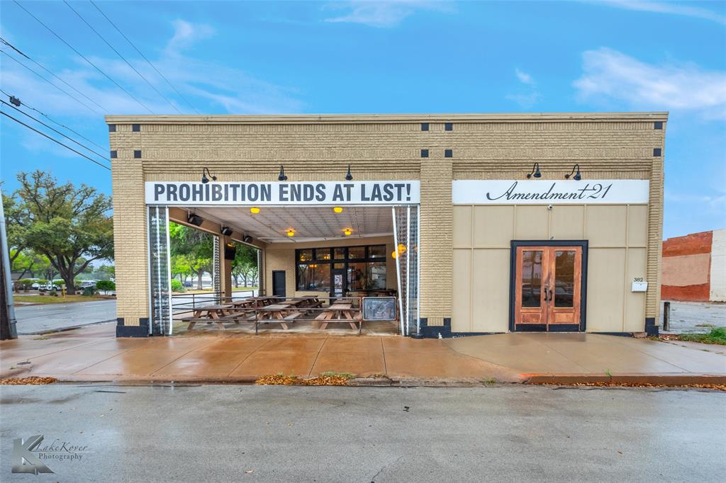 Check out this beautiful & fully remodeled 3,340 square foot air-conditioned building with an additional 1,160 square foot covered & heated patio in the SODA District. Renovations completed in 2018 include new plumbing, new roof, new HVAC, new electrical, new windows & new sprinkler system. The charm and character of the building was preserved with the original tin ceilings while bringing it up to date with two ADA compliant restrooms, catering kitchen, walk in cooler & other key features ideal for a variety of business uses. It currently operates as a bar called Amendment 21, but would be a great space for an attorney's office, bakery, various retail or small company headquarters.

Great investment property due to the redevelopment in South Downtown Abilene. With nearby businesses such as The Mill, Abilene Axe, Oak Street Shoppe, KAO Lounge, Big Country Beer Garden & more, as well as numerous private & County offices nearby, this property has anchors to support value. Also, with the multi-million dollar renovations to the Old Taylor County Courthouse as well as the upcoming 3.5M construction project about to begin at 833 South 1st, the future is bright for The SODA District!