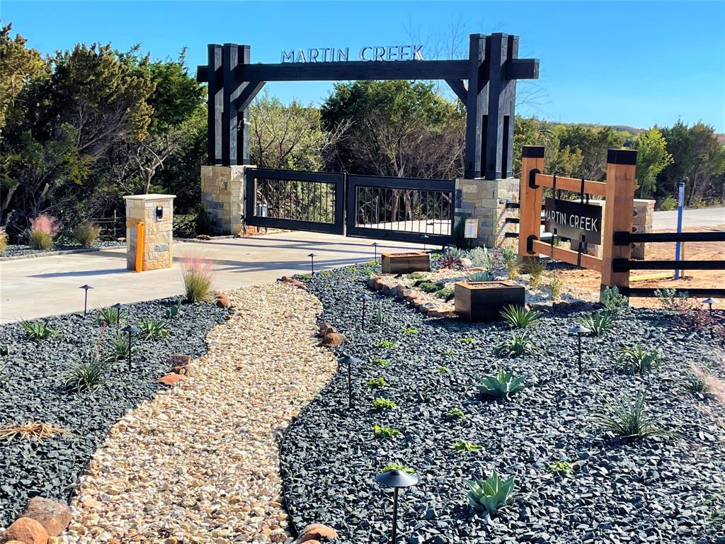 Exquisite 15.79 acre property with incredible views! Gated community with concrete streets, terrain changes, a rustic entrance, underground electric, only 26 lots, a 10 acre common area park with a 3+ acre lake, and endless views! NICEST COMMUNITY in Johnson Co.! Subdivision is NEXT LEVEL! VERY SPECIAL community that is hard to come by! Statement front entrance! Offers a common area park where families can gather and enjoy family and friends! Pond and small lake in this beautiful community is a great place where families can fish and spend quality time together! There is no time restriction on when you build a house so you can build immediately or wait many years! If you want a rare, unique, one-of-a-kind estate, ranchette that is an outstanding long-term investment, this is it!