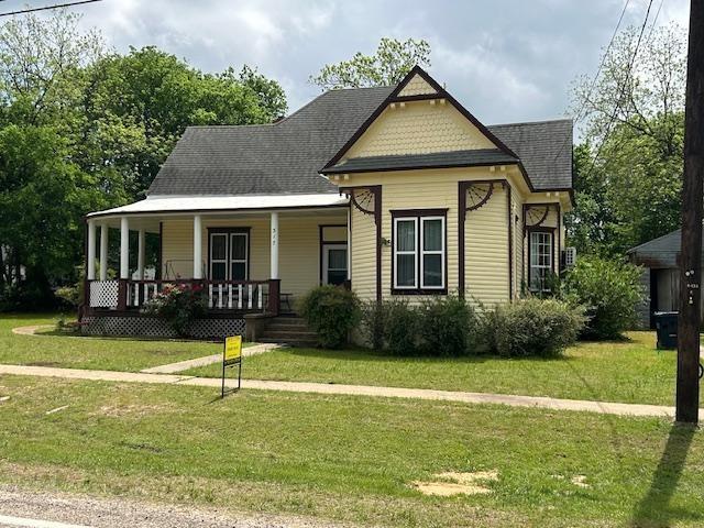 3440 sf - 5Br - 2Ba on .44 ac IN TOWN close to the beautiful City Park and Duck Pond.  This Whimsical Craftsman style home with Victorian Flair offers  so much room for the whole family and then some. The large rooms connect throughout as to hardly cross paths while entertaining. Each room has an accent to the era of 1910 with decorative fireplaces and gingerbread woodwork that frames the entry.  Original turn-style doorbell, high ceilings and an attic so large with easy access to hold all the seasonal decor and extra treasures.  Property sits on .44 ac, large yard for play and a highly vintage all metal, wood frame, two small car garage or great storage area.  Amazing curved covered front porch, a well sized back porch and a balcony from the second floor with a birds eye view overlooking the large backyard.  This home offers many years to a new family to make memories galore and call it home.