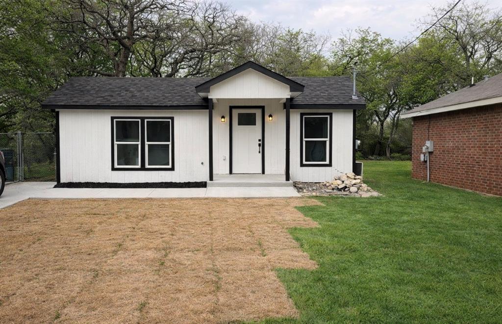 Welcome to this fully renovated 2-bedroom, 1-bath home offering approximately 812 sq ft of efficient, open-concept living. This move-in ready property features a functional layout that maximizes space while maintaining a clean, modern feel. This home is close to schools, stores, restaurants, major highways, and Lake Worth lake. 

The main living area flows seamlessly into the kitchen, which is equipped with quartz countertops, stainless steel appliances, custom cabinetry, and a functional island with seating. The open layout creates a natural flow between the living area and kitchen.

Both bedrooms offer flexibility for a variety of needs, including a primary bedroom, guest room, or home office. The bathroom features modern finishes and a clean, updated design.

Additional features include luxury vinyl plank flooring throughout and an energy-efficient mini split system for heating and cooling.

This property is ideal for first-time buyers, downsizers, or investors seeking a low-maintenance home with contemporary finishes.

Schedule your showing today.