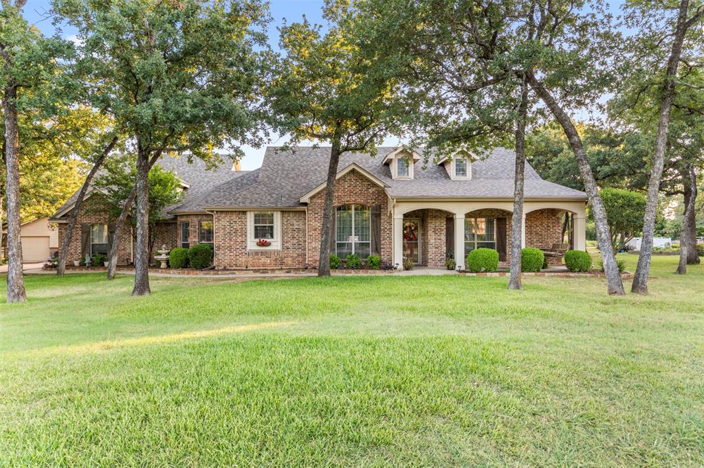 Welcome to 3900 Creekside Ct., Burleson, TX—a stunning home offering over 2,600 square feet of thoughtfully designed living space on a beautifully treed 1-acre lot in the highly desirable Timber Creek neighborhood. Located outside Burleson city limits with no HOA, this exceptional property offers the perfect blend of privacy, freedom, and convenience while being zoned for Burleson ISD. This beautifully maintained 4-bedroom, 2.5 bath home features a 3-car attached garage, plus a pool house complete with a full bathroom and an additional 1-car garage, creating incredible flexibility for guests, hobbies, or extra storage. A spacious, welcoming front porch sets the tone for this warm and inviting home. Inside, you'll immediately appreciate the 10-foot ceilings throughout the main floor. The thoughtfully designed split-bedroom floor plan offers privacy for everyone. The spacious primary suite is tucked away on one side of the home, while three generously sized bedrooms and a full bathroom are located on the opposite side. The heart of the home is the lovely kitchen featuring a center island, double ovens and a nice sized pantry. Entertaining is effortless with the adjacent formal dining room, making family celebrations a breeze. Just off the kitchen, the staircase leads to an incredible media room complete with its own half bathroom—perfect for movie nights, watching the big game, or creating the ultimate entertainment space. Step outside to your backyard oasis featuring a sparkling swimming pool and relaxing hot tub. This home truly checks every box. Conveniently located just minutes from shopping, dining, entertainment, and major highways, 3900 Creekside Ct. offers the rare opportunity to enjoy peaceful country-style living without sacrificing modern conveniences. A new roof was installed in June 2026. Don't miss your chance to own this exceptional Timber Creek property!