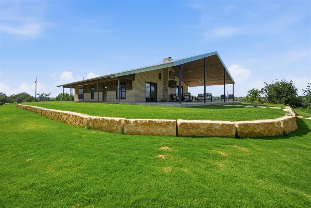 Nestled in the highly sought-after Morgan Mill area, this exceptional 112-acre ranch offers premier hunting, outstanding improvements, and year-round enjoyment just 90 minutes from the Dallas-Fort Worth Metroplex. Located in one of Erath County’s most proven whitetail regions, this property has produced trophy-class deer, including bucks exceeding 160 inches harvested right on the ranch.

The land is highlighted by more than a mile of the North Paluxy Creek, creating a scenic setting while providing outstanding wildlife habitat. Towering hardwoods line the creek bottom, offering excellent cover and travel corridors for deer, turkey, and other native wildlife. The diverse landscape includes two established food plots, a productive hay meadow, hardwood-lined creek bottoms, and approximately 150 feet of elevation change. The rolling topography provides stunning views, excellent habitat diversity, and multiple hunting opportunities across the property.

A remodeled three-bedroom, two-bath home, featuring modern finishes, and comfortable living spaces ideal for a full-time residence or weekend getaway. Nearby, a newly constructed 3,500-square-foot shop provides ample room for equipment, vehicles, ranch operations, and recreational storage. Guests and family members will appreciate the private one bedroom, one bath apartment, offering comfortable accommodations.

The outdoor kitchen and lounge area create the perfect setting for entertaining, whether hosting family gatherings, hunting weekends, or relaxing evenings overlooking the ranch. Recreational amenities  include a dedicated driving and chipping range along with a manicured putting green, allowing you to enjoy a round of practice without ever leaving the ranch.

Whether you're searching for a premier hunting ranch, a weekend retreat, or a legacy property to enjoy for generations, this Morgan Mill ranch offers a rare combination of natural beauty, recreation, and first-class improvements.