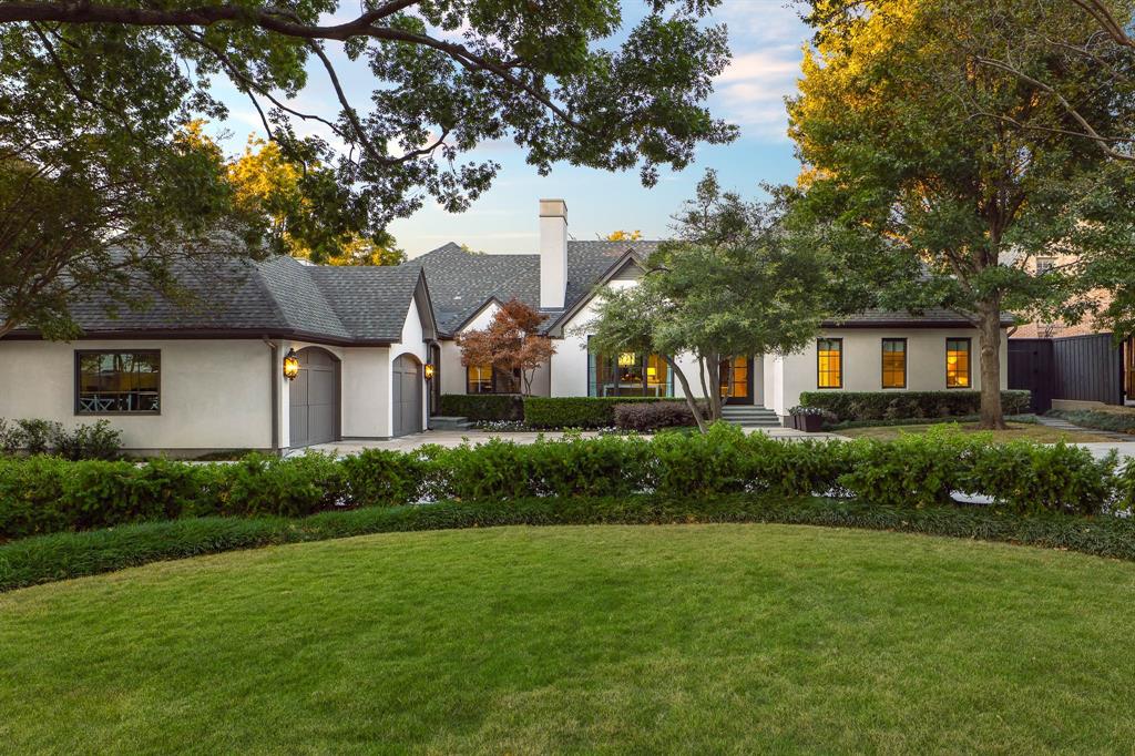 Experience a rare offering in the heart of Preston Hollow, set on an oversized interior lot that provides exceptional privacy. Reimagined in 2022 by David Stocker of SHM Architects and Gonzalo Bueno of Ten Plus Three, and expertly built by Knox Built of Tatum Brown Custom Homes, this one-of-a-kind residence blends architectural excellence with elevated design.
Spanning 6,184 square feet on a single level and situated on a 0.459-acre lot, the home showcases extensive customization, state-of-the-art technology, and refined designer finishes throughout. The Eggersmann kitchen anchors the home with Gaggenau appliances, custom cabinetry, a hidden wet bar and an inviting breakfast area. A fully equipped butler’s pantry adds two Wolf ovens, a dishwasher, Scotsman sonic ice maker, and wine refrigerator.
The primary suite is a private retreat featuring a lounge area, spa-inspired bath with heated marble floors, dual vanities, separate water closets and two boutique closets with one wrapped in Macassar ebony paneling with eight integrated watch winders.
Designed for effortless entertaining, the home offers multiple living areas, three interior fireplaces, and expansive steel windows overlooking the landscaped backyard and pool. The outdoor loggia includes a remote-controlled mosquito screen and views of the pool’s water feature and landscape lighting, while a fenced dog run adds convenience.
Notable features include a hidden steel, temperature-controlled tornado-safe room, concealed safe, epoxy-finished garage with custom storage, LED art lighting, whole-house Generac generator, and advanced security with exterior cameras. The stucco exterior sits on a highly engineered pier-and-beam foundation with French drains, dual sumps, and ventilation fans. With mature landscaping and no rear alley, this home delivers privacy, sophistication, and exceptional livability in one of Dallas’ most sought-after neighborhoods.