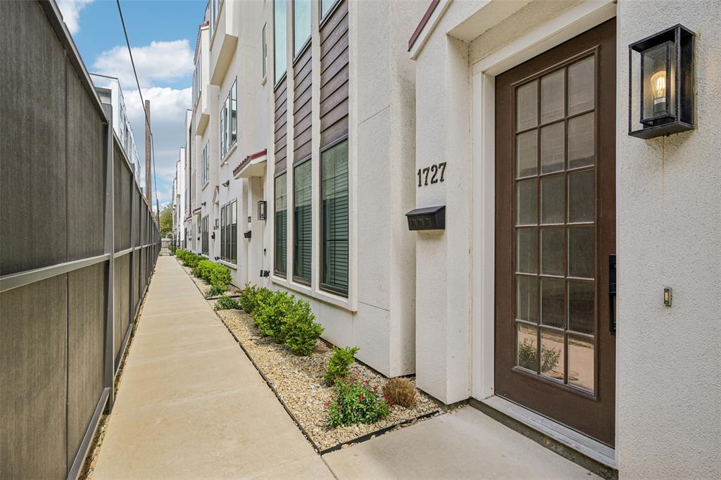 Looking for city living without the noise? Check out 1727 Novela Way at the Mirar at the Cedars for a 3 bed, 3 and one half bath, multi-level, fee simple, new construction home with more than 2000 sq ft of living space. The open floor plan on the 2nd level with 11’ ceilings and oversized picture windows allow natural light to flood the space and live larger than it seems. The chef’s kitchen with Samsung appliances and the oversized center island with waterfall quartz is ready for you to entertain friends and family.
The 3rd floor primary suite has 10’ ceilings, a walk-in closet with a window, a spa-like bath with a deep soaking tub, an oversized walk-in shower, floating cabinets and high-end Delta fixtures. Outside the primary suite is a coffee bar or snack center with built-in cabinets adjacent to the utility closet with built-in cabinets. The 3rd floor guest room also has an en-suite bath with walk-in shower. The 1st floor guest room has an en-suite bath with a deep soaking tub.
Utilize the bonus room on the 4th floor for workout space, an office or a Zoom room. You could also set up a wet bar for entertaining on your rooftop patio as the bonus room is plumbed for water and is located next to the rooftop patio. 
Upgrades include: Level 4, smooth finish walls; solid core doors; spray foam insulation throughout; a tankless water heater; high end aluminum windows; 3-layer stucco exterior; metal Spanish tiles and more. The property is gated with code access and has a community dog park.
Located in the Cedars known for Lee Harvey’s, the Dive-In swim club, Full City Rooster coffee shop, Baby Back Shack BBQ, Mike’s Gemini Twin and more. Minutes from downtown and multiple highway systems makes the metroplex commute easier from 1727 Novela Way.