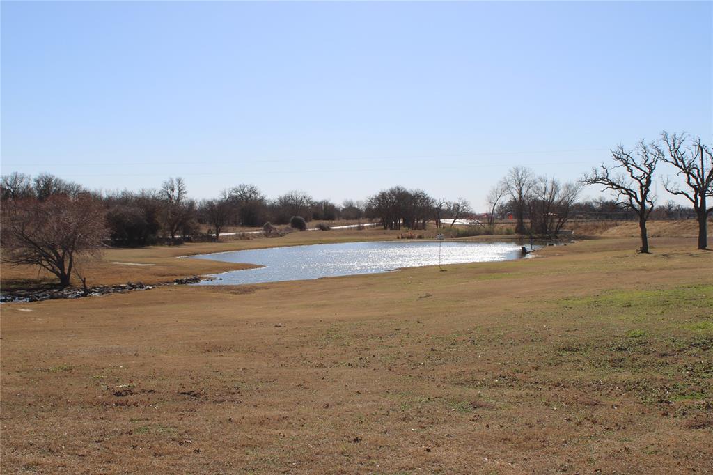 Waterfront lot in Highland Oaks subdivision is an exclusive gated community offering homeowners exceptional privacy, peace of mind, catch and release fishing at our 3 private, landscaped retention ponds, a community center with large, covered patio, a junior Olympic swimming pool, and a children's wading pool. Highland Oaks is a green community with approximately 26% of the land reserved as a greenbelt and common areas. Highland Oaks is designed to provide the ultimate in luxury country estate living with the convenience of full city services. Water, gas and electric utilities are all underground. Three area school districts are accepting students who live in Highland Oaks. Boyd, Paradise and Decatur offer opportunities for parents to choose the best education experience for their children. Several lots to choose from so look in pictures for more lot information.