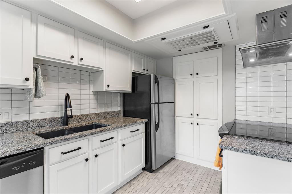 **Priced below tax appraised value** Perfectly positioned in the heart of Dallas, this beautifully updated condo offers modern style, functional living, and unbeatable convenience near Love Field Airport, Highland Park Village, Uptown, the Medical District, Bishop Arts District and all that Dallas as to offer. Inside, you’ll find hardwood flooring throughout, an updated kitchen, spacious bedrooms with walk-in closets, and abundant built-in storage throughout the home. The inviting and updated main level features a generous living area, dining space, powder bath, and a well-appointed kitchen designed for both everyday living and entertaining. Upstairs, both bedrooms provide comfort and privacy along with a hall bath featuring a tub and  shower combination. Step outside to enjoy the private backyard deck complete with a large 6x3 storage closet. Convenient access to the North Dallas Tollway makes commuting to Downtown, Uptown, or North Dallas quick and easy.