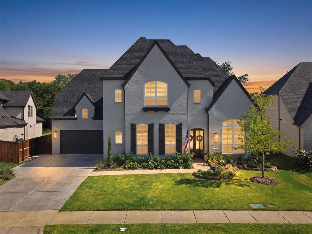 Discover an exceptional opportunity to own a truly one-of-a-kind waterfront retreat in Trinity Falls. Situated on a rare 70-foot waterfront lot, this Highland Home offers a premium homesite that is increasingly difficult to find, along with hundreds of thousands of dollars in luxury improvements that elevate it far beyond the original builder offering.
From the moment you step inside, walls of windows fill the home with natural light while showcasing the thoughtfully designed floor plan and breathtaking water views. Offering approximately 4,534 square feet, this impressive home features 5 spacious bedrooms, each with its own en suite bathroom, 2 half baths, a private study, formal dining room, game room, media room, and a 3-car garage—providing exceptional space for everyday living and entertaining.
The backyard is where this home truly separates itself. Professionally designed to create a private resort, you’ll enjoy a modern, sleek custom pool overlooking the water, complemented by extensive hardscape, maintenance-free turf, a putting green, and an expansive outdoor living area. The beautiful pavilion features a fully equipped outdoor kitchen, creating the perfect setting for entertaining, dining, and enjoying the incredible waterfront views year-round. Whether hosting friends or relaxing poolside, every detail was designed to maximize the exceptional setting.
Inside and out, this home offers the perfect blend of luxury, comfort, and functionality—all within one of McKinney’s most desirable master-planned communities. Enjoy access to resort-style Trinity Falls amenities, highly rated McKinney schools, and a convenient location near popular destinations including Buc-ee’s, shopping, dining, and everyday conveniences. If you’ve been searching for waterfront living on a rare oversized lot with designer finishes, incredible outdoor amenities, and a home that surpasses new construction, this is the one.