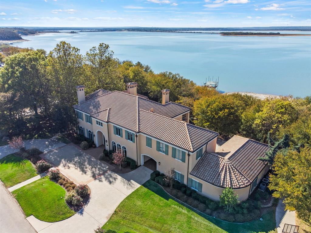 BUY THIS $2.1 mm home for the SAME PAYMENT as a $1.9 mm home. UPGRADE NOW! SELLER FINANCING AVAILABLE at LOWER THAN MARKET RATES. Rates from mid 5% to mid 6% depending on down payment, saving 23K in closing costs. 20% down MINIMUM. Pre-approval required with Leahy Lending. No formal underwriting, lower closing costs, no discount points, close in as fast as 10 days. INDULGE IN LUXURY! Breathtaking custom built mediterranean lake front, 2-acre estate. Custom designed and constructed w the highest quality w impeccable craftsmanship & finishes throughout. Expansive living spaces down, great for entertaining. Strategically positioned primary suite offers panoramic views of the lake, private gym w 2 verandas. All bedrooms are ensuite plus a separate entry apartment. Terraced backyard features a heated pool, spa & cabana w kitchen & full bath. Workshop with AC & XL 3+car garage. 231 ft lake frontage featuring covered dock, boat slip, & 2 personal watercraft lifts. Secure your paradise now!