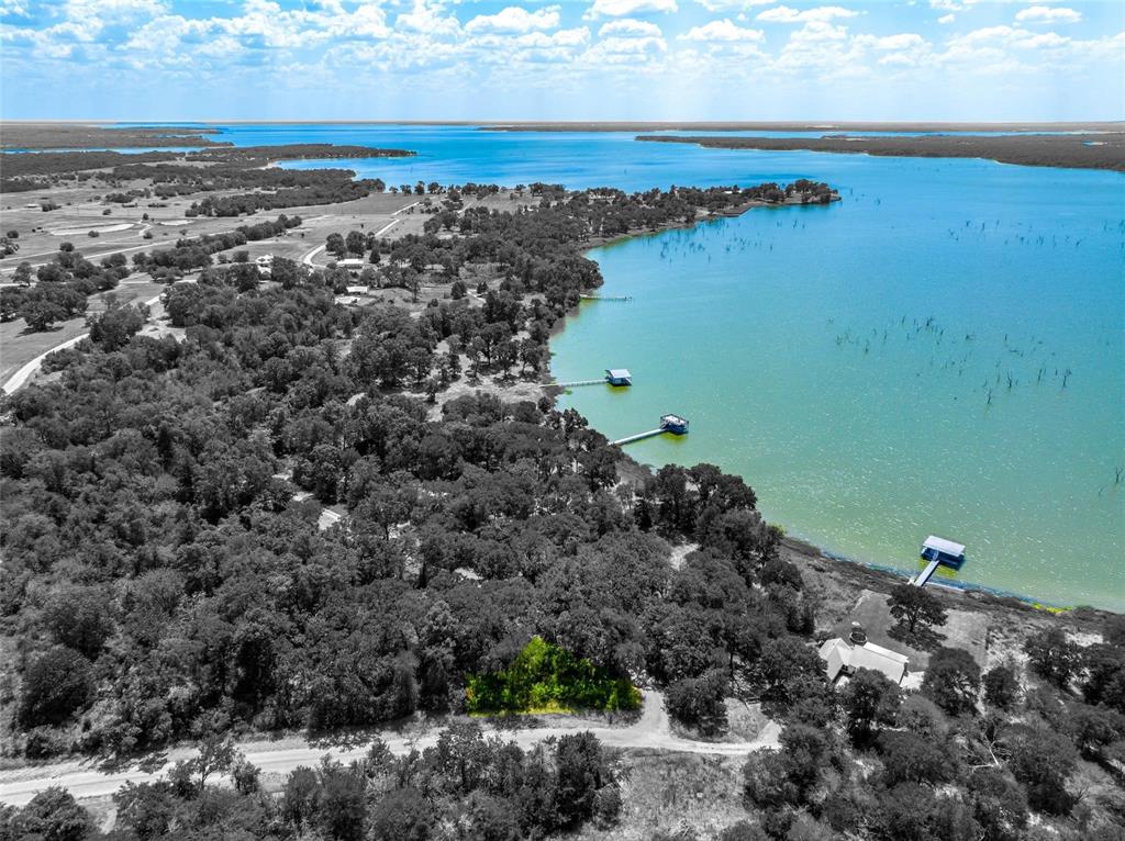 Embrace the opportunity to craft your dream residence by the tranquil shores of Lake Tawakoni within the prestigious Rocky Ford Addition. This exclusive subdivision boasts a plethora of amenities, including a refreshing swimming pool, well-maintained tennis courts, a convenient boat ramp, a charming fishing pier, and a delightful picnic area. Nestled just an hour east of Dallas and a mere 20-minute drive south of Greenville, this gated community offers a peaceful oasis for your future dream home. Don't let this chance slip away to create your ideal haven in this serene and secure enclave. This lot is inside the gates of Rocky Ford and is 0.271 of an acre. Please make note: Sabine River Authority governs these lots including how large a lot needs to be for a septic tank. Electric is on-site and water is through Cash Water SUD.