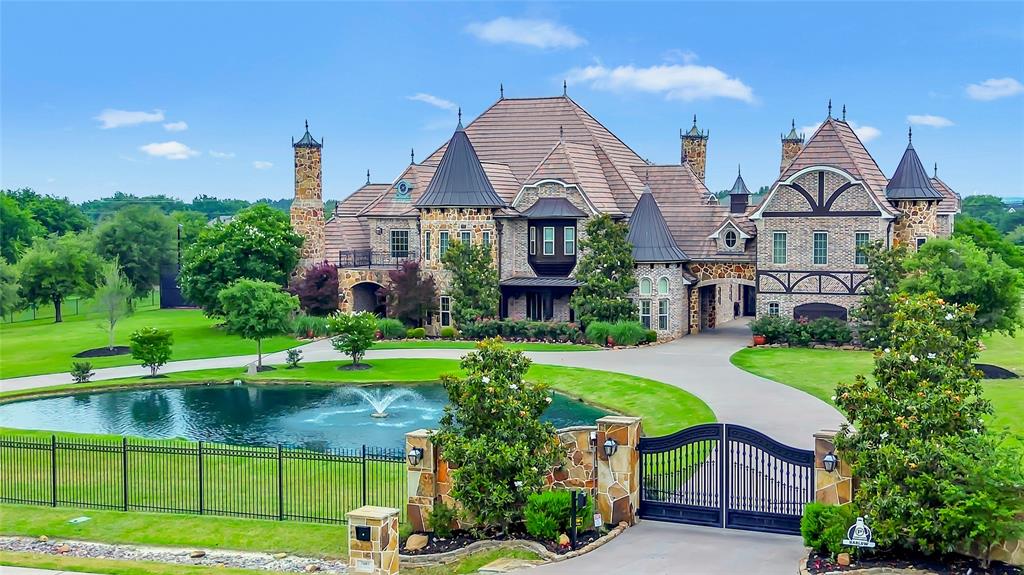 Positioned on nearly three private acres in one of North Texas’ most sought-after estate communities, this exceptional residence offers a rare blend of space, privacy, and elevated living—an experience simply not found in Frisco, Plano, or along the traditional corridor. This is where buyers transition when they’re ready to move beyond density and into a true estate lifestyle without sacrificing convenience. From the gated approach to the expansive grounds, the property immediately conveys a sense of arrival and exclusivity. Inside, the home is designed to impress while remaining warm and livable, featuring soaring ceilings, rich architectural detail, and walls of windows that seamlessly connect indoor and outdoor living. At the heart of the home, multiple living and entertaining spaces flow effortlessly into a chef-inspired kitchen, creating the perfect environment for both daily living and hosting. Step outside to your private resort-style setting, complete with a pool, expansive entertaining areas, and a full outdoor basketball court—delivering a lifestyle that rivals luxury retreats. Thoughtfully designed for today’s buyer, the home offers private bedroom suites, dedicated work-from-home spaces, media and game rooms, and multiple living zones—allowing for productivity, relaxation, and entertaining without compromise. Located in one of North Texas’ fastest-growing corridors, this property represents both a luxury lifestyle and a strategic investment. With convenient access to major destinations, premier shopping and dining, and miles of trails and green space, you are ideally positioned between privacy and connectivity. This is more than a home—it’s a statement for those who value space, success, and a lifestyle that stands apart.