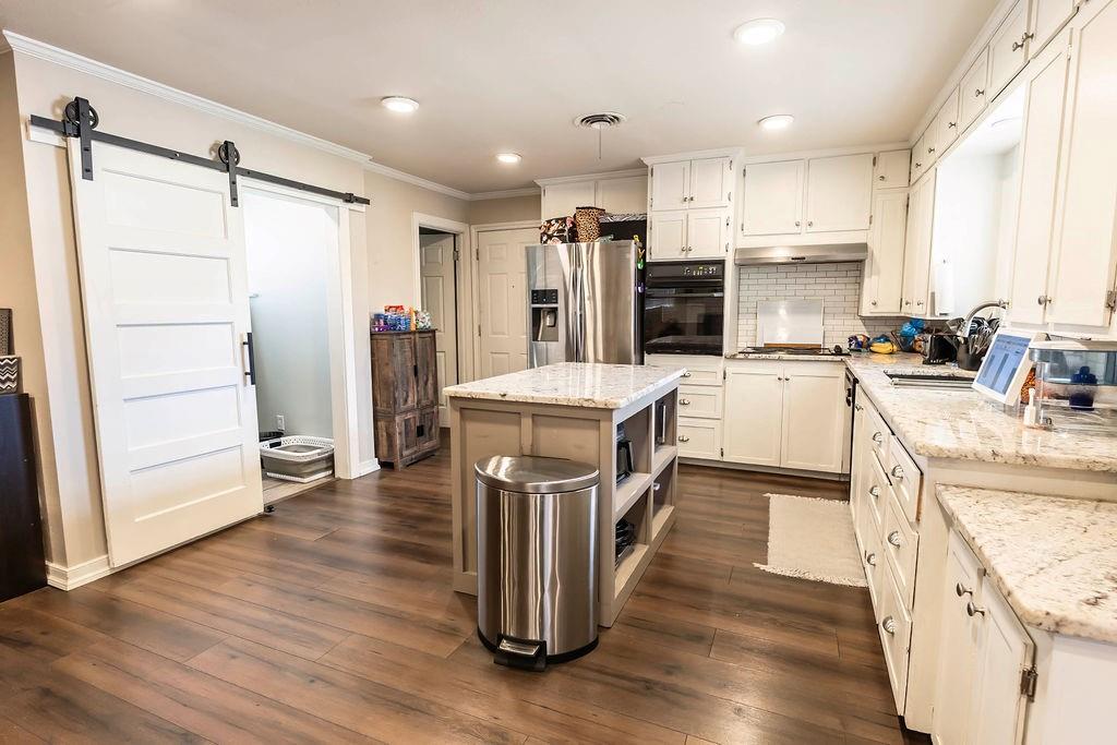 Investor Opportunity—Brick 4BR 2.5BA + Sunroom. Cash Only Investors, step forward—this solid brick home is ready for its next chapter.  Featuring 4 bedrooms and 2.5 baths with a large open floorplan, this property offers the space and layout today’s buyers and renters love. Off the living room, a bright, spacious sunroom adds even more flexibility and is currently being used as a 5th bedroom—ideal for maximizing value. A two-car garage provides plenty of room for parking, storage, or a workshop setup. Conveniently located near local attractions, this is a prime chance to renovate, refresh, and unlock the upside. While the pier and beam foundation does need a little love, the repairs could be paid for and still leave you with enough equity to turn a major profit! Being a 4 bedroom, 3 bath home- the rental income alone would help this property pay for itself.