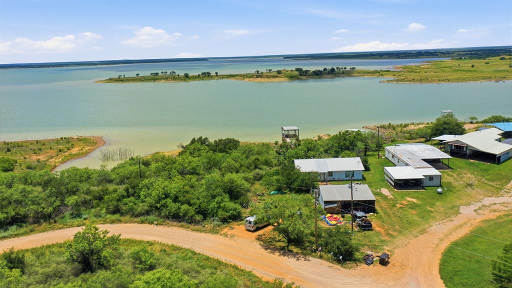 Waterfront Home on Private Road 2742 in Breckenridge, TX!
This inviting 2-bedroom, 2-bath waterfront home sits on over half an acre in the North Coves First subdivision. The open-concept kitchen flows seamlessly into the dining and living areas, creating a bright and welcoming space for entertaining or relaxing. Both bedrooms feature large walk-in closets, and the home includes a separate utility room, central heat and air, all-electric utilities, and a durable metal roof.
Outside, you'll find a spacious 3-car carport and a 25x20 storage building with an overhead door for all your lake toys and equipment. The highlight is the excellent ~20x20 boat dock complete with a boat lift, storage area, and fish cleaning station—perfect for easy lake access. The property is conveniently located near a public boat ramp and offers fantastic opportunities for fishing, boating, and lakeside living.
A fantastic weekend retreat or full-time lake home.


Tenant occupied home. 24 hour notice is required.