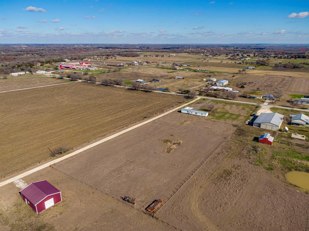 Rare opportunity to own approximately 3 acres in Grandview with existing utilities and homesite improvements already in place. Property includes an existing manufactured home being sold AS-IS. Seller makes no representations regarding the condition of the home, and buyers are encouraged to conduct their own inspections and due diligence.

Property features an existing water meter, electric service, septic system, driveway, and established homesite. The manufactured home may require substantial repairs, renovation, or replacement depending on the buyer's intended use.

The value of this property is primarily in the land, utilities, septic system, and existing site improvements, offering a variety of possibilities for future use. Excellent opportunity for an investor, builder, or buyer looking for acreage with infrastructure already in place.

Located outside city limits. Buyer to verify all information, restrictions, utilities, and intended use.