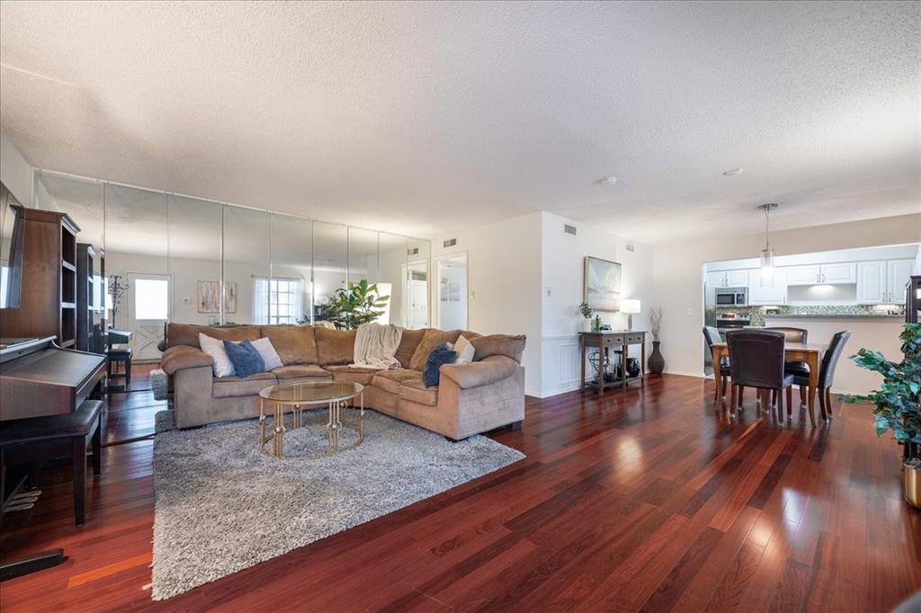 Nestled within the gated community of La Fontaine, this beautifully maintained garden-style condominium offers a peaceful retreat in one of Dallas' best-kept secrets. Surrounded by mature trees, the community provides a serene setting while remaining close to everything the city has to offer.
This desirable second-floor corner unit features a spacious, open-concept layout with rich hardwood floors throughout the living and dining areas. Both generously sized bedrooms include private en-suite bathrooms, making the floorplan ideal for roommates, guests, or a home office setup. Brand-new carpet was installed in both bedrooms in February 2026, and ample closet space and storage can be found throughout the home.
The kitchen showcases white cabinetry, stainless steel appliances, a pantry, and plenty of workspace. Refrigerator, washer, and dryer are all included, making this home truly move-in ready.
Enjoy the convenience of an assigned covered parking space (#65) located near the entry gate, along with abundant guest parking. Residents also have access to a private community pool just steps away.
Perfect for those seeking a lock-and-leave lifestyle, this centrally located condo is within walking distance of Central Market and Ridgewood Trail, with quick access to Downtown, SMU, Greenville Avenue, and Northpark Center. Easy access to main thoroughfares North Central Expressway (75) and Northwest Highway.