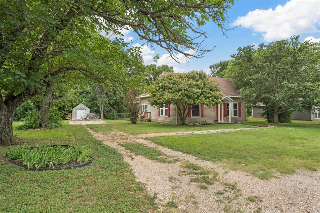 Discover this beautifully remodeled 3-bedroom, 2-bathroom home nestled in the heart of Bosque County! The property boasts a stunningly renovated master bedroom paired with a brand new bathroom, providing a perfect retreat. Enjoy the charm of original hardwood floors in select areas, complemented by stylish vinyl flooring in others. The kitchen has been recently upgraded with modern cabinets, an eye-catching backsplash, and a sleek countertop, featuring gas appliances for the culinary enthusiast. Fresh paint throughout, elegant crown molding, and contemporary lighting add a touch of sophistication to the space. Situated on a spacious lot, this home is surrounded by mature trees and includes a fenced yard, making it an ideal environment for children and pets to play safely. Don’t miss the opportunity to make this exquisite property your new home!