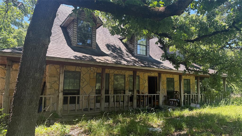 Sip sweet tea from a porch swing on the expansive wraparound porch while taking in peaceful views of the pond and rolling acreage beyond. This modern farmhouse is a true diamond in the rough, offering endless potential for the right buyer to restore it to its full beauty with a little vision, elbow grease, and love.

Nestled on nearly 10 acres in Kaufman County, this spacious ranch-style home blends the charm of country living with the comfort of a modern floorplan. Built in 2001, the home features approximately 2,872 square feet with 4 bedrooms, 2.5 bathrooms, multiple living areas, vaulted ceilings, decorative lighting, and stunning stone wood-burning fireplaces that create a warm and inviting atmosphere.

The kitchen offers custom built-in cabinetry and an eat-in dining area ideal for gathering with family and friends. The oversized primary suite includes a spacious ensuite bath with dual sinks, a soaking tub, separate shower, and walk-in closet. Secondary bedrooms feature custom closet systems and built-ins for added functionality and storage.

Step outside and enjoy all the property has to offer, including a gunite in-ground pool, covered patio spaces, fenced acreage suitable for horses or recreation, and a picturesque pond that adds to the property's peaceful setting. With co-op water, septic service, and convenient access to I-20, you can enjoy the privacy of rural living without sacrificing accessibility.

This unique property presents an exceptional opportunity for buyers seeking acreage, versatility, and the chance to create their own Texas retreat. The home does require TLC and is being sold as-is. Seller will make no repairs. Buyer and buyer’s agent to verify all information, including measurements, schools, zoning, and property condition. All reasonable offers are invited.