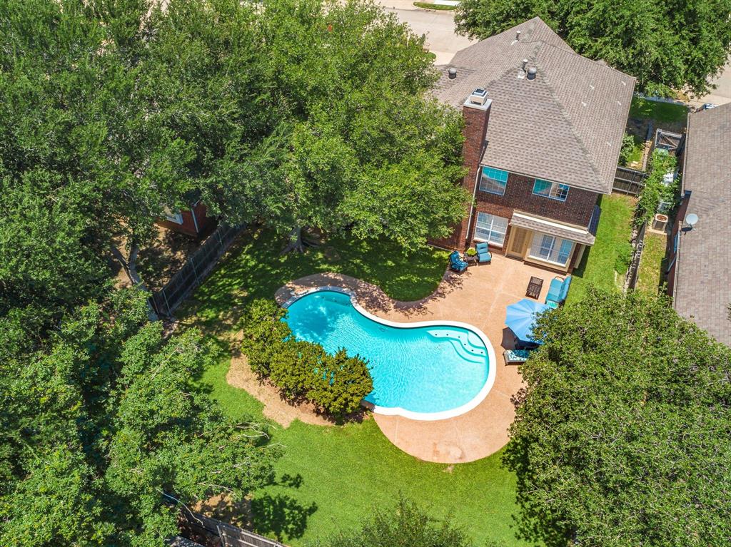 Open Saturday 1-3pm. $10K SELLER CREDIT TO BUYER FOR CLOSING COSTS OR RATE BUY DOWN. This is your chance to see this Beautifully Updated 4 Bedroom 2.5 Bath Modern Style Home. BOTH AC Units replaced 2020-2022. Terrific location allows for Convenient Commuting while benefiting from the quiet neighborhood surroundings that includes Tealwood Park.  The Dramatic 2 Story Entry welcomes guests with Woven Ratan Lighting and Luxury Vinyl Plank Flooring throughout the 1st Floor.  The Formal Dining is spacious for large dining table & a buffet and could easily be converted into a Study. When entering the Kitchen you’ll be impressed with the Abundant Amount of Cabinetry freshly painted White with Brushed Nickel Handles. Quartz Counters were added with Exquisite Marble Backsplash and Energy Efficient lighting added to brighten your Cooking Experience.  The Breakfast area is filled with Natural Light and a clear view of the Sparkling Pool.  This winter, the Gas Fireplace will come in handy!  The Oversized Primary Bedroom Suite has plenty of room for a King Size Bed and Furniture with a view of the Mature Trees and beautiful backyard oasis.  The Primary Bath has been updated with Designer Selected New Counters, Faucets, Tub, Toilet and Frameless Glass Shower.  Even the Primary Closet is Spacious! Upstairs Enjoy a Massive Gameroom that’s ready for a Large Screen TV, or add a Pool Table, or make it a Playroom, the options are endless.  Bedrooms 2, 3 and 4 are supported by the upstairs bath which includes dual sinks with Quartz Countertops, Updated Tub, Tile and toilet, plus linen closet.  The Backyard is truly a place to escape to Relax and host Summer Gatherings as you and your guests take a dip in the pool.  All of this in addition to being zoned to the STEM School of Donald Elementary, a bike ride through the Flower Mound Trails to Heritage Park, The Hound Mound and the Community Activity Center coupled with nearby Shopping and Dining make this home a Must See!!
