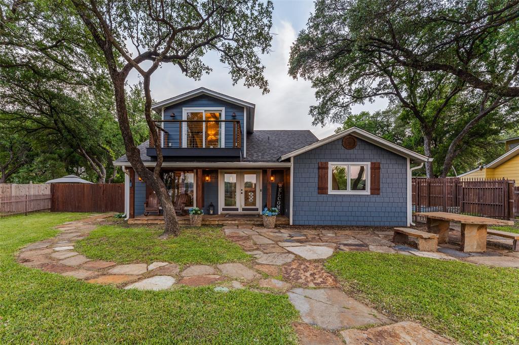 This inviting lakefront retreat on Lake Worth was designed with families in mind—where everyday life slows down and the best moments happen together. With over 3,300 square feet of bright, open living space, there’s room for everyone to spread out, gather up, and truly enjoy the lake lifestyle. Warm hardwoods, wood-look tile, and clean, timeless finishes create a home that feels both elevated and comfortable from the moment you walk in.
At the heart of the home, the kitchen is where everything comes together—morning pancakes before a day on the water, snacks for the kids, and big family dinners after sunset. An oversized island, farmhouse sink, custom cabinetry, and a walk-in “super pantry” make hosting effortless, while the dedicated coffee bar keeps mornings running smoothly. The primary suite offers parents a peaceful escape, complete with a private balcony overlooking the lake—perfect for quiet mornings or unwinding after a full day outside. A spacious custom dressing room and thoughtful details elevate the experience, while additional spaces like a home office, exercise room, and functional mudroom help keep busy family life organized. What truly sets this home apart is the flexibility for hosting family and friends. A fully separate guest suite—with its own living area, kitchen, bath, and three bedrooms—creates the perfect setup for grandparents, visitors, or even older kids wanting their own space. Step outside, and the lifestyle really comes to life. The backyard is built for memory-making, featuring a resort-style pool and spa, a large screened-in porch for game nights and dinners, and plenty of space to relax after a day in the sun. Down at the water, a private dock with 2 lifts and 2 levels, multiple decks, makes boating, swimming, and sunset watching part of your everyday routine. Whether it’s summer weekends, holiday gatherings, or spontaneous midweek escapes, this is the kind of lake house where traditions are made and memories last for generations.