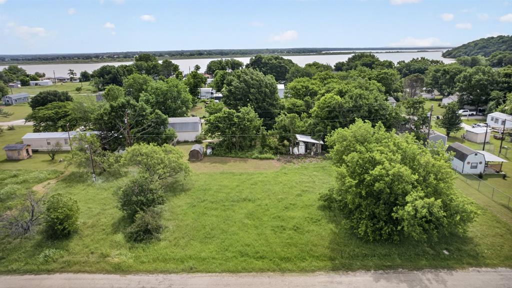 Build your dream home on this unique opportunity featuring three adjoining lots being sold together as one! With lot sizes all of 0.04 acres each, this property offers a combined total of 0.12 acres. The lots are cleared and ready for your new construction, making it easy to bring your vision to life. Whether you’re planning a primary residence, weekend getaway, or investment build, this property provides flexibility and potential in a growing area. Don’t miss your chance to secure multiple lots in one purchase—ready and waiting for your new home!
