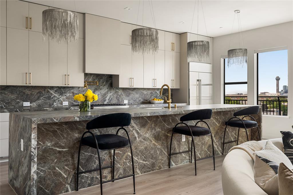 *Ask about limited-time Buyer Incentives, including a 2-1 buydown with the Preferred Lender, and $10k toward buyer closing costs!*

Welcome to Penthouse 609 at The Ruston, one of eight remaining exclusive penthouse residences and truly one of the crown jewels of this new-construction luxury condominium building on the edge of Downtown Dallas. Located in the vibrant Cedars neighborhood, this two-story, 3,062 SF, 2-bedroom, 2.5-bath penthouse offers unobstructed panoramic views of the Dallas skyline and an elevated standard of luxury living. Floor-to-ceiling windows illuminate expansive living spaces, showcasing soaring ceilings, a dramatic floor-to-ceiling fireplace, and an expansive private terrace with sweeping skyline views ideal for refined entertaining. The chef’s kitchen features an oversized porcelain-slab island, side-by-side Monogram refrigerator, 6-burner Monogram gas range with pot filler, walk-in pantry, and a bar area with wet bar and wine cooler. Thoughtfully curated designer finishes and premium materials define every detail. Residents enjoy access to an exceptional suite of resort-style amenities, including a reflection pool, state-of-the-art fitness center, media room, wine room, game room, clubhouse, conference room, dog run with wash station, pickleball court, putting green, and outdoor lounge and grilling areas—delivering a truly elevated penthouse lifestyle in one of Dallas’ most dynamic neighborhoods.