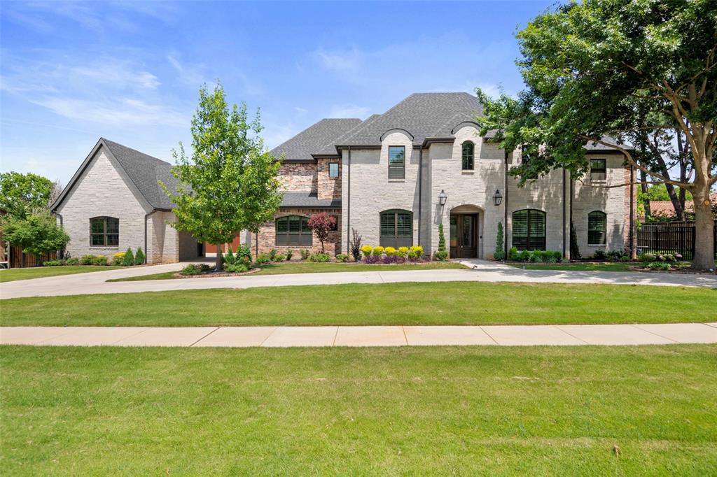 Builder’s Private Custom Home.  Let the Builder customize this home for you! Built with meticulous attention to detail by the original builder for personal use, this one-of-a-kind home combines elegance, function, and quality craftsmanship throughout. Rich hardwood floors and custom cabinetry span the entire home, with a thoughtful emphasis on storage at every turn. The heart of the home features a spacious open floor plan anchored by a stunning two-island kitchen, equipped with quartzite countertops, high-end appliances, and a 60 inch Wolf gas cooktop with double ovens. This chef’s kitchen seamlessly connects the great room and a spacious informal dining niche, creating the perfect flow for everyday living and entertaining. A dedicated executive office offers a private and professional work-from-home space. The laundry room is exceptional, boasting an additional panel-covered Sub-Zero refrigerator freezer, farmhouse sink, and a built-in dog crate for your four-legged family members.  The first-floor primary retreat is complete with a spa inspired bathroom featuring dolomite vanities, a zero-entry shower, and a large custom closet. Two additional guest rooms are located on the main level, one with a zero-entry shower ideal for multi-generational living. Upstairs, a spacious fitness room with an ensuite bath could easily function as a second primary suite. Two more bedrooms are found on this level, including one currently used as a craft room with an extra storage closet in the ensuite. A media room with an adjacent storage room is ideal for AV equipment or hobby space. Outside, the backyard offers just the right amount of privacy and relaxation without high maintenance.  Featuring a modern barn with 3 rolling doors perfectly suited as a car enthusiast's dream workshop complementing the home's 4 car garage.  Conveniently located to DFW airport, shopping and dining. Award winning Grapevine-Colleyville ISD