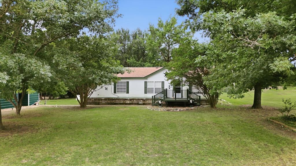 Looking for acreage with endless possibilities? This little-over-15-acre property in Leonard, Texas offers the freedom to create your own vision with no known restrictions! The property features a 3-bedroom, 2-bath double-wide home that could use some TLC, making it a great opportunity for those looking to renovate, invest, or use it as a temporary residence while building their dream home. The mobile home could potentially be moved, allowing you to take full advantage of the beautiful homesite.
A second homesite is already in place with its own septic system, providing even more flexibility for additional living space, a guest house, rental property, or future build. With approximately 600 feet of road frontage, mature trees, and plenty of room for livestock, recreational activities, workshops, equipment, or simply enjoying country living, this property is packed with potential.
Whether you’re searching for a homestead, investment opportunity, or the perfect place to build your forever home, this unrestricted acreage is ready for your ideas to come to life. Bring your vision and make this property your own! Call today for more information or to schedule a private tour.