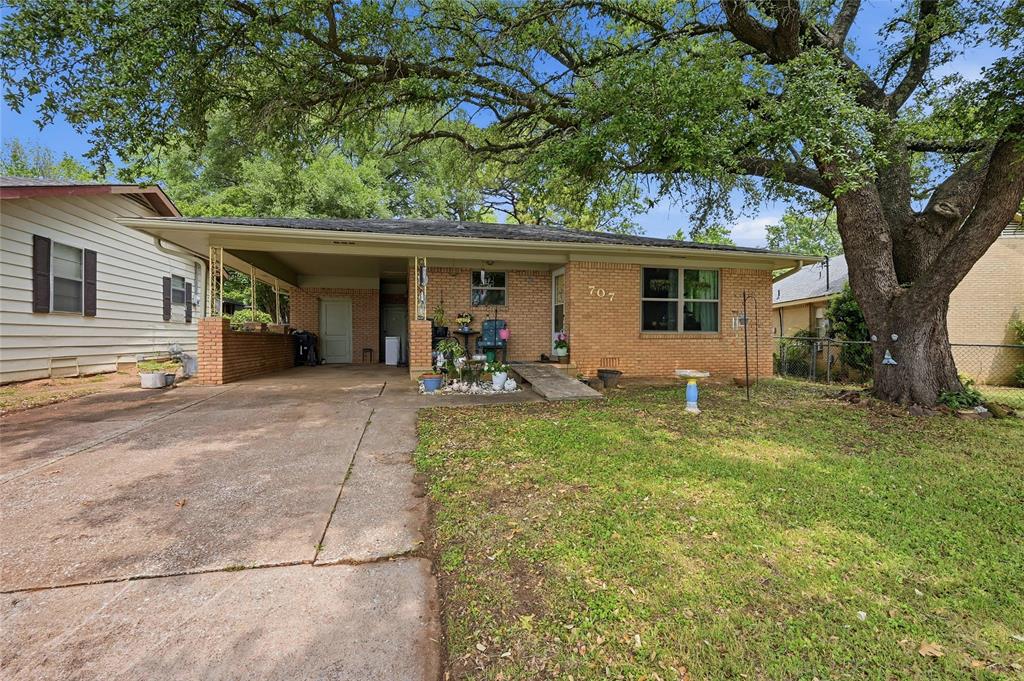 This classic brick home has been thoughtfully maintained by the current owner and offers classic curb appeal in a peaceful neighborhood. With 3 bedrooms and 1.5 baths, this home is a practical option for a first-time buyer or someone looking to downsize. The interior offers comfortable living space and lots of natural light, making it well suited for everyday life. The spacious backyard provides room to relax, garden, or entertain, while the driveway and covered carport add everyday convenience. The property is located close to downtown Denison and Highway 75, ensuring easy access to a variety of shopping and dining options.