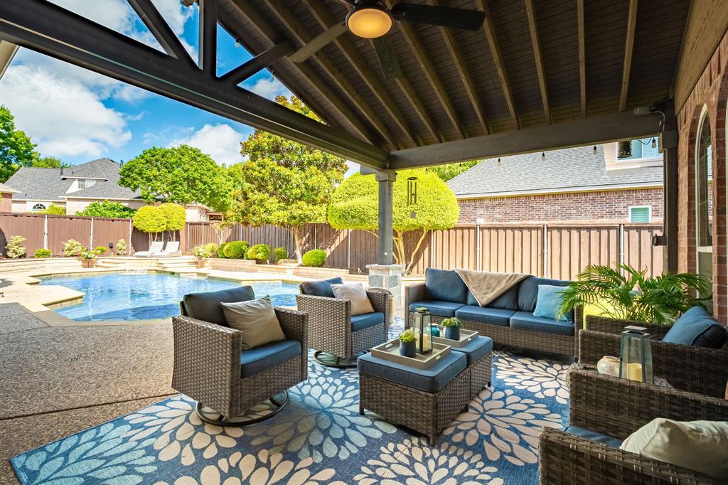 This cul-de-sac home welcomes you to your own BACKYARD OASIS, where a sparkling PebbleTec pool, outdoor kitchen, & vaulted covered living area invite you to relax and gather all year round. Inside, handscraped wood floors, cathedral ceilings, fresh neutral paint, & updated kitchen and baths create a welcoming space. Enjoy a beautiful & functional kitchen featuring freshly painted cabinets, granite counters, stainless steel appliances, double ovens, an island, & granite sink. The family room offers backyard views & is anchored by a gas fireplace framed with built-in cabinets. Spacious 2 story formal living and dining rooms offer space for special gatherings. Retreat to the primary suite with 2 closets & a fresh ensuite bath featuring a frameless shower with floor-to-ceiling tile, tub, & quartz counters. A second bedroom downstairs (currently used as an office) sits next to another beautifully updated bath. A cozy book nook on the way upstairs invites quiet moments. The second level offers 3 bedrooms, a large gameroom with a built-in desk and cabinetry, a Jack & Jill bath, & another full bath. The 35,000 gallon pool with water feature is the backyard centerpiece, with an elevated open patio for sunning & a HUGE 340 sq ft extended roof patio for relaxing, catching a game, or watching amazing sunsets. Add remote patio shades, a stone kitchen with leathered granite counters, built-in grill, fridge, storage & Big Green Egg plus a privacy fence for peaceful outdoor living. An additional side yard beside the driveway offers versatile space, and a convenient shed keeps all your outdoor gear organized. Walking distance to Boon Elementary and easy access to Hwy 75 and SH 121. Shopping and dining minutes away at Watters Creek, The Farm, HUB 121, & Villages of Allen. Twin Creeks residents enjoy an amenity-rich lifestyle including tennis, sand volleyball, miles of walking paths, & two pools. Twin Creeks Golf Club, an Arnold Palmer designed course, is minutes away.