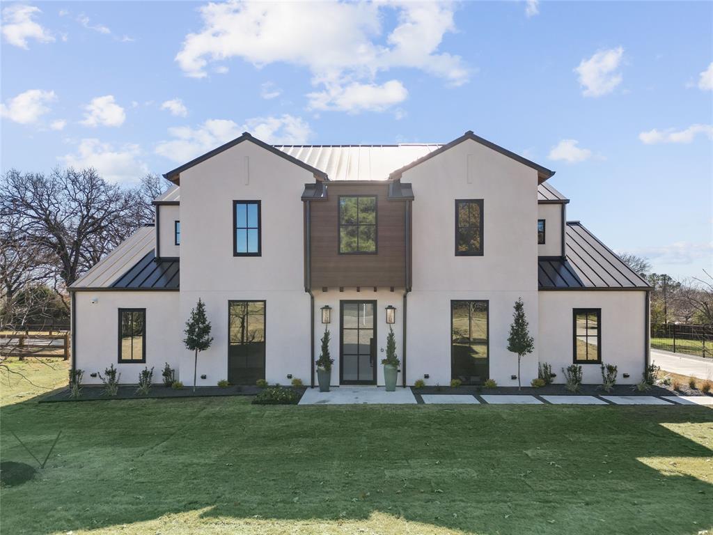 Just completed, a true masterpiece with high end detail. This four bedroom, five bath home is located in a serene neighborhood with no HOA. A huge yard with mature trees provides lots of room for a pool, pickleball court, or just enjoy the beauty of the land. The stucco home is finished with custom windows that allows the natural light to flood in, and sliders in the main living room for ease of entertaining around the outdoor fireplace and built-in grill. An open concept living room and kitchen with a sizeable island to fit barstools, has a soaring ceiling with wood beam, fireplace and an 83-inch Samsung picture frame TV that stays with the home. The beautiful chef inspired kitchen has GE Monogram appliances including three ovens, built-in microwave, and refrigerator-freezer. An enormous, hidden walk-in pantry with a small fridge and an abundance of storage and counter-top space makes meal prepping and entertaining seamless. The Owner's Retreat with a cathedral ceiling and wood beam has a coffee center with a small beverage refrigerator, a spa like en-suite with make-up vanity and steam free lighted mirror, separate vanities, stand-alone tub, over-sized shower with bench, and a huge walk-in closet with large built-in his and her dresser and third tier pull down racks for seasonal clothes. An In-Law Suite has a private entrance and patio along with a full bath and walk-in closet. The flex room on first floor is perfect for a gym, second office, fifth bedroom, etc. Two additional bedrooms, each with their own en-suite and walk-in closet, and a large game room are on the second floor. Additional features are an executive office that faces the front yard, large dining room, mud area off the three-car garage, laundry room with a sink and storage with lots of counter-top space, two walk-out attic spaces that is great for storage, hardwood flooring and much more. Too many details to list. Please contact listing agent for additional details and see attributes page in docs.